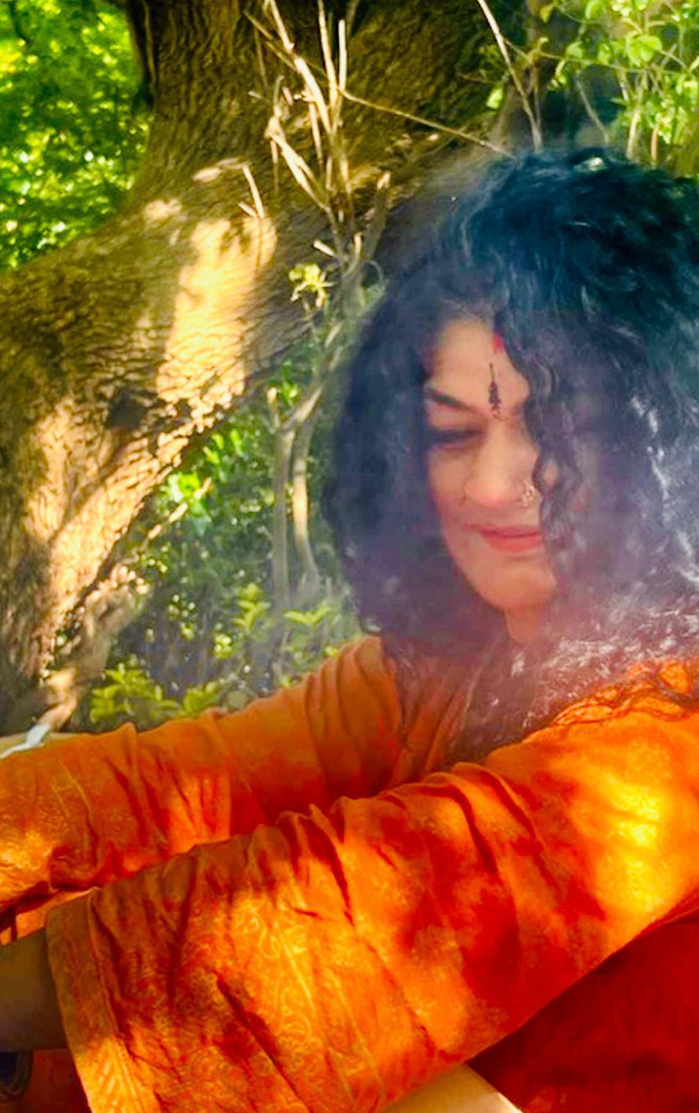 Sundeep in quiet reflection beneath the trees